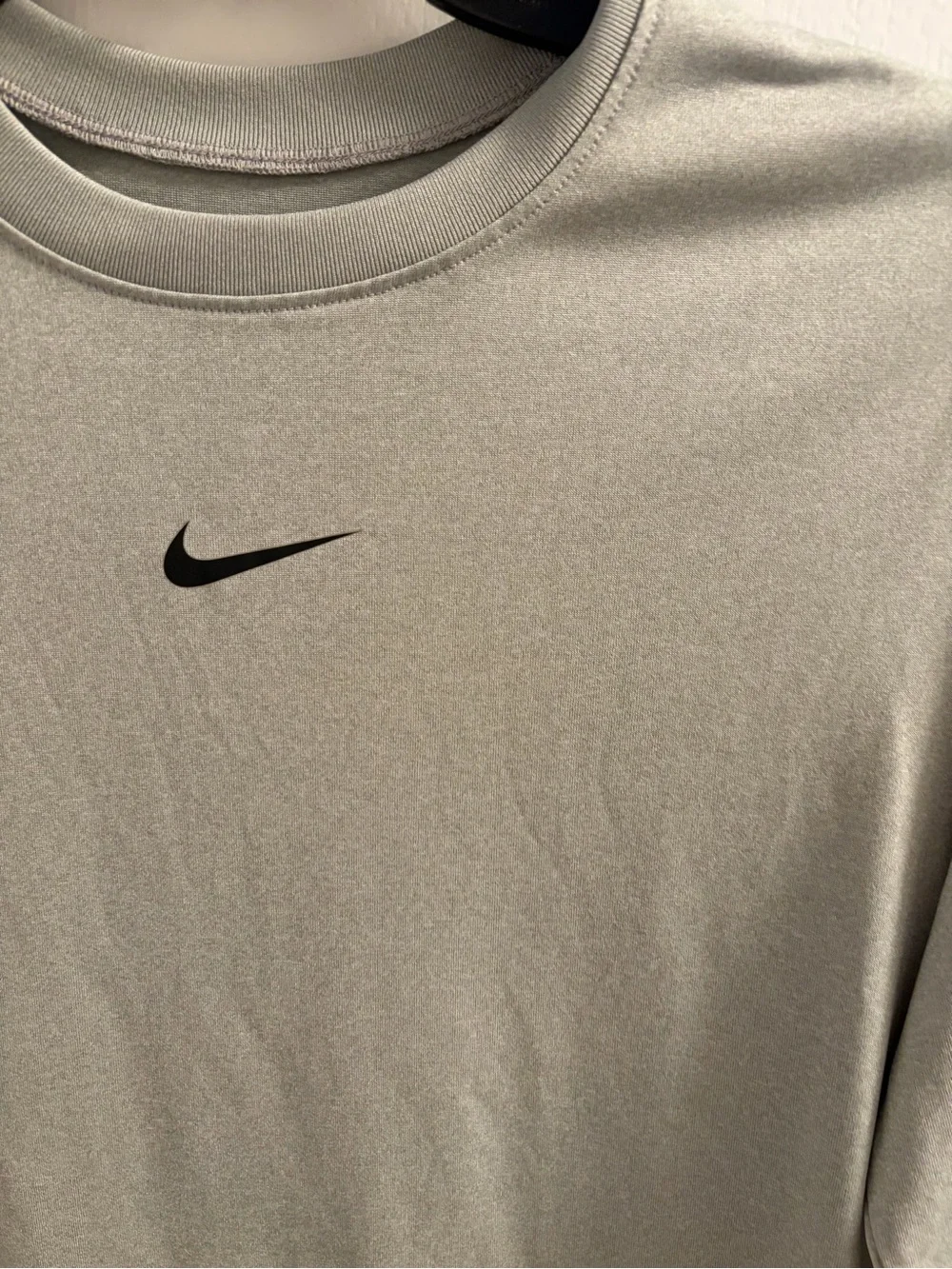 Nike Light Gray Long Sleeve Athletic Top with Black Swoosh
